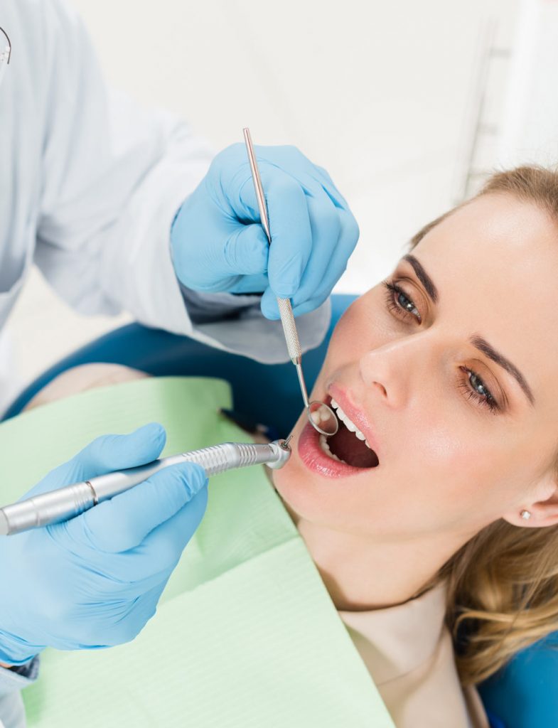 Female patient undergoing a dental procedure.